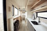Kitchen, Ceiling Lighting, and Undermount Sink Ample natural light enters via the multiple windows. As you can see above, stylish cabin vibes flood the home.

  Photo 7 of 14 in This Sleek Travel Trailer Is Practically a Cabin on Wheels from Land Ark RV - Drake