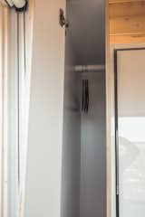 Custom end-table closets are on each side of the Murphy bed. 
