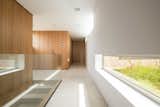 Hallway and Limestone Floor  Photo 11 of 16 in M3 House by OLARQ Osvaldo Luppi Architects