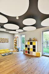 therapy room/ playroom with round acoustic ceiling panels