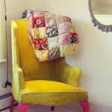 A funky chair in the corner of the master bedrooom.