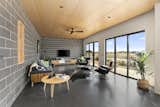 Living Room, Concrete Floor, Chair, Ceiling Lighting, Coffee Tables, Sofa, and Recliner  Photo 2 of 19 in Dune 1 by Inverloch 3996