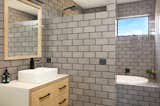 Bath Room, Concrete Floor, Open Shower, Ceramic Tile Wall, Drop In Tub, Wood Counter, Ceiling Lighting, Subway Tile Wall, Pedestal Sink, and Two Piece Toilet  Photo 12 of 19 in Dune 1 by Inverloch 3996