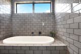 Bath Room, Ceiling Lighting, Open Shower, Drop In Tub, Ceramic Tile Wall, Two Piece Toilet, and Subway Tile Wall  Photo 15 of 19 in Dune 1 by Inverloch 3996