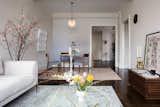 From the view from the living room, the color theme is changed to the various shades of grey. In the dining room, open to the living room, has a grey gradient backdrop, creating a subtle and elegant mood.