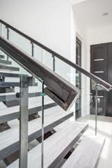 Pairing glass and metal to create a showpiece staircase.