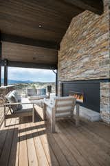 Extending the living area into the outside including an outdoor fireplace makes this home well equipped to host a crowd.