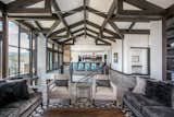An intricate ceiling combine with the railing surrounding the staircase to allow the eye to dance around this room admiring so many features. 