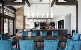 Lofty ceilings keep the open, airy flow to this modern mountain kitchen leaving ample room for the adjacent dining area.