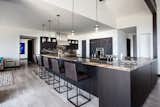 Dark cabinets offset the white walls creating a warm, inviting kitchen.
