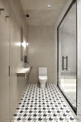 The bathrooms are visually and texturally divided into ceramic granite wet areas and painted dry areas.