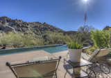 Outdoor, Trees, Back Yard, Landscape Lighting, Shrubs, Boulders, Hardscapes, and Large Pools, Tubs, Shower Resort Style Living  Photo 5 of 14 in Organic Architecture in Arizona by Amy Murphy - Scottsdale & Paradise Valley Realtor