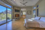 Bedroom, Accent Lighting, Recessed Lighting, Ceiling Lighting, Bed, and Light Hardwood Floor Master sanctuary with private patio, views and star gazing spa.  Photo 7 of 14 in Organic Architecture in Arizona by Amy Murphy - Scottsdale & Paradise Valley Realtor