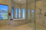 Spa style master bath graced in natural finishes.
