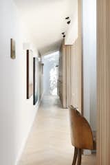 Hallway and Light Hardwood Floor  Search “bathfloors--light-hardwood” from The Courtyard House