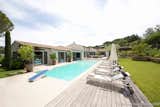Outdoor, Wood Patio, Porch, Deck, Back Yard, Trees, Gardens, Swimming Pools, Tubs, Shower, Walkways, and Large Pools, Tubs, Shower Swimming pool is part of living space.   Photo 1 of 4 in Le Mas de la Cordeliere, Sun-Splashed Saint-Tropez Villa Asks €4.9m by London International Realty