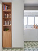 You can still infuse open kitchen shelving into your space without foregoing all cabinetry. For instance, base cabinets typically should maintain their doors, as it's easier to get lower shelves dirty and damage any dishware inside.