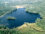 Exterior Aerial photo of the lake and the inlet that is very special to kayak through, you can see how private and pristine it all is!   Photo 4 of 40 in Maine Lake House & Cabins (Family Camp Compound) by Christina Sidoti