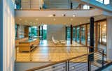 Kitchen, Undermount Sink, Wall Oven, Light Hardwood Floor, Wood Cabinet, Recessed Lighting, Ceiling Lighting, and Engineered Quartz Counter  Photo 7 of 9 in White Stone by Randall Kipp