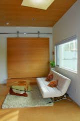 8x8 ft custom door that reveals separate apartment to create loft-like living