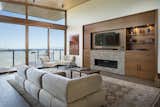 The spacious and open living room looks out on an amazing view of the Monterey Bay.