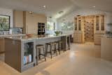 Kitchen features an ample island and wine display and storage