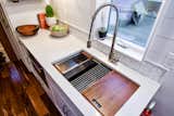 Beautiful, stainless steel, multifunctional sink makes the kitchen more efficient.