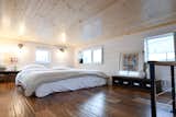 Bedroom, Bed, Wall Lighting, and Dark Hardwood Floor Large Main Loft  Photo 18 of 24 in Solar Tiny for Family of 5. by Tru Form Tiny