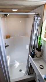 Bath Room, Full Shower, and Wall Mount Sink Small Comfortable Shower. Tru Form Tiny  Photo 17 of 28 in Full Solar Tiny Home & Open Layout by Tru Form Tiny