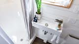 Bath Room, Full Shower, Wall Mount Sink, and Wall Lighting Small Comfortable Bathroom. Tru Form Tiny  Photo 7 of 15 in 15 Tiny Bathroom Ideas For a Beautiful and Functional Space from Full Solar Tiny Home & Open Layout