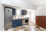 Blue kitchen and storage above