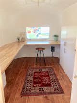 Office, Desk, and Dark Hardwood Floor  Photo 7 of 13 in Modern Airstream Office by Andy Schnack