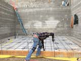 Ricardo getting ready for the garage concrete pour. Insulation under slabs for LEED