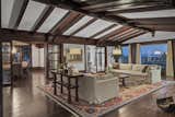 Gorgeous original wood beams invite the homeowner into this elegant yet cozy living room with beautiful views of the Bay Area.