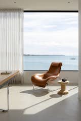 A picture window looks out from the office to the bay. 