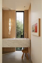A solid block of marble, CNC'd into the powder room sink and vanity, was quarried not far away on Vancouver Island. 