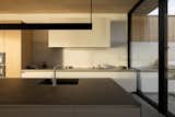 The backsplash is bushhammered and brushed Vancouver Island marble inside and out. 