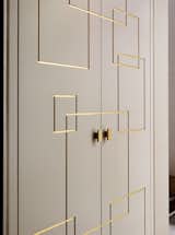 Gallery -  fitted Cupboards and Doors  evoking the Art Deco styling of the 1920s synonymous with Western Europe, are these beautifully designed cupboards with geometric gilded door fronts, hung on custom made pivot hinges.