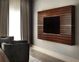 Living Room - Media Unit - TV surround combining natural Rosewood and Stainless Steel. Designed to be recessed in to the wall, this TV surround is designed using rosewood panels