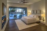 Master Bedroom Suite features pool access, 2-way fireplace, Spa Bath and His & Hers walk-in Closets