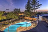 Exterior, House Building Type, Flat RoofLine, Stucco Siding Material, and Stone Siding Material City Lights View From Sky-Deck Overlooking Pool  Photo 7 of 15 in The Allen House by Todd Headlee