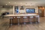Modern Kitchen with Oversized Center Island Open to Dining and Great Room Areas with Pass-Through Serving Window to Pool Area for Entertaining