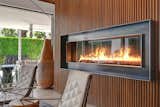 The original Playboy Pad had a circular fireplace connecting the living room and master bedroom.  This has been reworked with a stunning vertical gas fireplace connecting the two rooms.