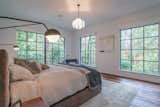 Master bedroom with large windows.