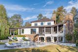 Outdoor, Side Yard, Large Patio, Porch, Deck, Swimming Pools, Tubs, Shower, Shrubs, Raised Planters, and Stone Fences, Wall Pool and deck area  Photo 17 of 29 in The Tourville Home by Gregory A Butler