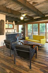Living Room, Sofa, Dark Hardwood Floor, and Chair Reclaimed mixed hardwoods flooring and reclaimed industrial salvaged timbers balance the open and modern decor of this ADU in Portland OR.   Photo 1 of 5 in Vermont Street ADU by Pioneer Millworks