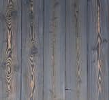 LARCH CINDER

Traditionally Inspired American Made™. This 18th century technique of preserving wood with fire is refreshed for today’s design. Aggressively burning the surface layer of our sustainably harvested Larch, we then wire-brush each plank multiple times to remove the soft char and expose the contrasting grain below. This heavily textured and visually dynamic surface can be left unfinished or can be coated with an exterior grade finish in a selection of cool greys, warm browns, or a pop of color.

Larch is a durable wood exterior option with attractive tones, interesting grain patterns, rot, insect and fire-resistant. Our Shou Sugi Ban Larch Twice-Brushed can just as comfortably clad an interior wall providing a bold statement to any indoor design.