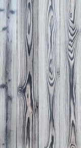 LARCH WHITE

Traditionally Inspired American Made™. This 18th century technique of preserving wood with fire is refreshed for today’s design. Aggressively burning the surface layer of our sustainably harvested Larch, we then wire-brush each plank multiple times to remove the soft char and expose the contrasting grain below. This heavily textured and visually dynamic surface can be left unfinished or can be coated with an exterior grade finish in a selection of cool greys, warm browns, or a pop of color.

Larch is a durable wood exterior option with attractive tones, interesting grain patterns, rot, insect and fire-resistant. Our Shou Sugi Ban Larch Twice-Brushed can just as comfortably clad an interior wall providing a bold statement to any indoor design.