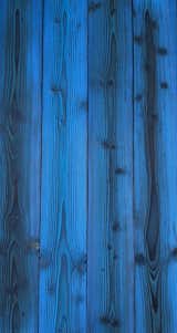 LARCH COBALT

Traditionally Inspired American Made™. This 18th century technique of preserving wood with fire is refreshed for today’s design. Aggressively burning the surface layer of our sustainably harvested Larch, we then wire-brush each plank multiple times to remove the soft char and expose the contrasting grain below. This heavily textured and visually dynamic surface can be left unfinished or can be coated with an exterior grade finish in a selection of cool greys, warm browns, or a pop of color.

Larch is a durable wood exterior option with attractive tones, interesting grain patterns, rot, insect and fire-resistant. Our Shou Sugi Ban Larch Twice-Brushed can just as comfortably clad an interior wall providing a bold statement to any indoor design.