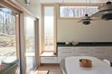 Dining Room, Chair, Track Lighting, Table, Lamps, Pendant Lighting, Ceiling Lighting, Light Hardwood Floor, and Storage  Photo 7 of 8 in Foal Home and Studio by Gehrung+Graham